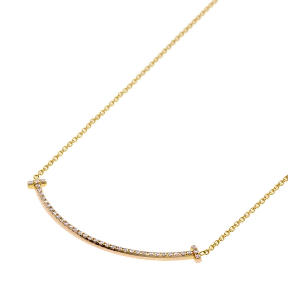 Tiffany & Co. T Smile Small Diamond Necklace, 18K Yellow Gold, Women's.: --- Catalog ---Category: SizePendant Size: 3.6mm x 37mm / 0.14'' x 1.45''Neck Circumference: 40 cm / 15.74''Category: DesignStone: DiamondGender: WomenMaterial: Yellow gold (18K)Necklace Type: Necklac