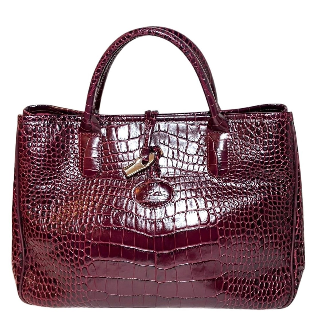 Longchamp Roseau handbag, embossed leather: --- Catalog ---Category: SizeSize (HxWxD): 10cm x 34cm x 12.5cm / 3.93'' x 13.38'' x 4.92''Category: DesignType: HandbagColor: PurpleGender: WomenMaterial: Leather Leather/Fur Type: Embossed