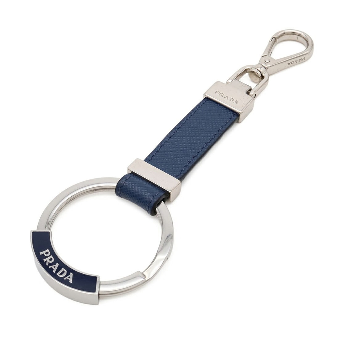 PRADA Keychain Charm Keyring Saffiano Leather Metal Navy Blue 2PP042: --- Catalog ---Category: DesignType: KeyringColor: NavyGender: WomenMaterial: Leather, MetalCategory: GeneralBrand: Prada--- Item List ---Section: ConditionRanking: Rank A Used - A few traces of usage