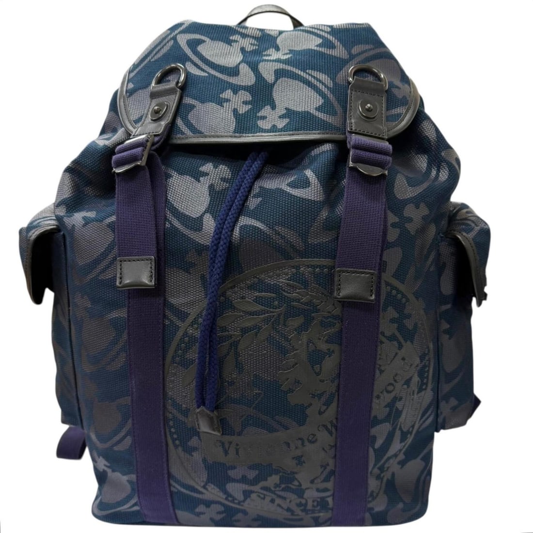 Vivienne Westwood canvas and leather backpack with orb camouflage pattern, navy, made in Japan, for: --- Catalog ---Category: SizeSize (HxWxD): 48cm x 42cm x 19cm / 18.89'' x 16.53'' x 7.48''Category: DesignType: BackpackColor: NavyGender: MenMaterial: Canvas , Leather Category: GeneralBrand: Vivienn