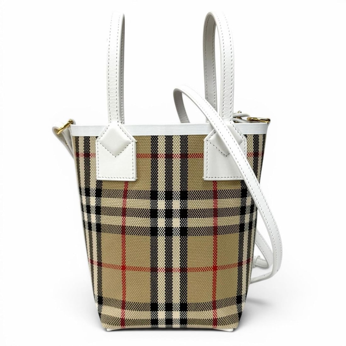 Burberrys 8072348 Canvas Nova Check Pattern Leather Trim Mini London Tote 2-Way Shoulder Bag Beige: --- Catalog ---Category: SizeSize (HxWxD): 18cm x 19.5cm x 8.5cm / 7.08'' x 7.67'' x 3.34''Category: DesignType: Shoulder bagColor: Beige, WhiteGender: WomenMaterial: Canvas , Leather Category: Genera