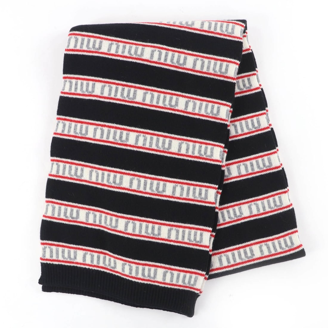 MIUMIU (Miu Miu) 2021 Model 0000EF Virgin Wool Cashmere Logo Border Knit Scarf, Black, 270 x 1700: --- Catalog ---Category: SizeSize (LxW): 1.68m x 26cm / 66.14'' x 10.23''Category: DesignType: StoleColor: BlackGender: WomenMaterial: Wool , Cashmere Category: GeneralMPN: 0000EFBrand: Miu MiuCountry