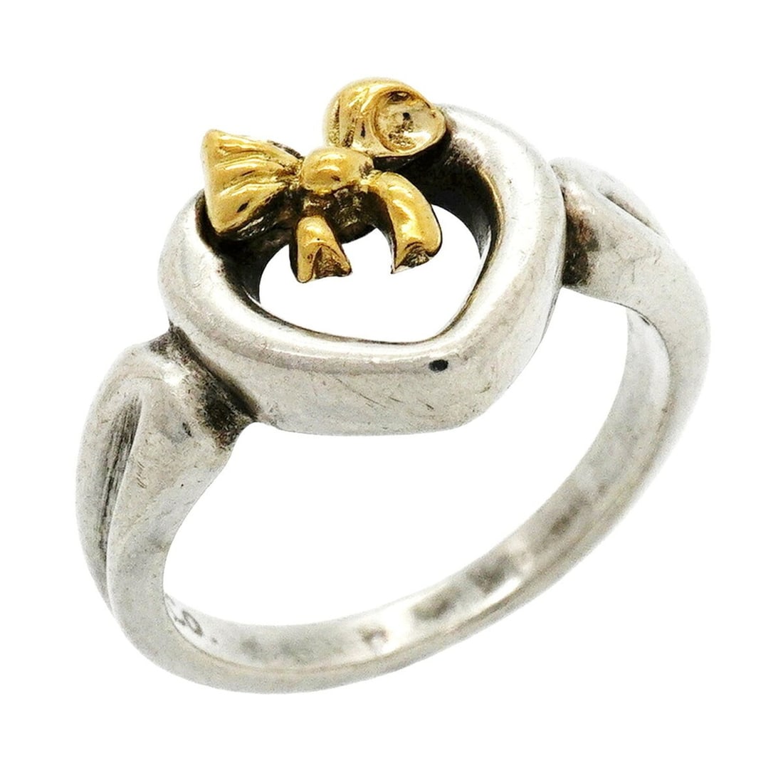Tiffany & Co. Heart Ribbon Ring, 18K Yellow Gold (KYG), Sterling Silver 925, Size 8.5, Women's: --- Catalog ---Category: SizeJP Size: 8.5US Size: 4.5Category: DesignType: Band ringGender: WomenMaterial: Silver 925, Yellow gold (18K)Category: GeneralBrand: Tiffany--- Item List ---Section: Conditi