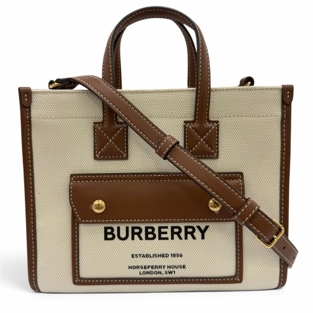 BURBERRY Mini Freya Canvas Leather 2-Way Tote Bag/Shoulder Bag in Ivory and Brown, Made Italy,: --- Catalog ---Category: SizeSize (HxWxD): 18cm x 23cm x 8cm / 7.08'' x 9.05'' x 3.14''Category: DesignType: Shoulder bag, Tote bagColor: Brown, IvoryGender: WomenMaterial: Canvas , Leather Category: 