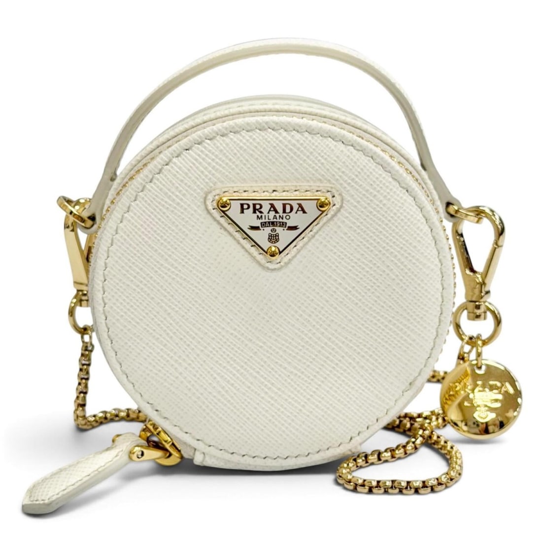 PRADA 1NR023 Saffiano Leather Triangle Logo Chain Shoulder Round Mini Pouch White Gold Hardware Made: --- Catalog ---Category: SizeSize (HxWxD): 8cm x 8cm x 4cm / 3.14'' x 3.14'' x 1.57''Category: DesignType: PouchColor: WhiteGender: WomenMaterial: Leather Hardware Color: GoldLeather/Fur Type: Saffian