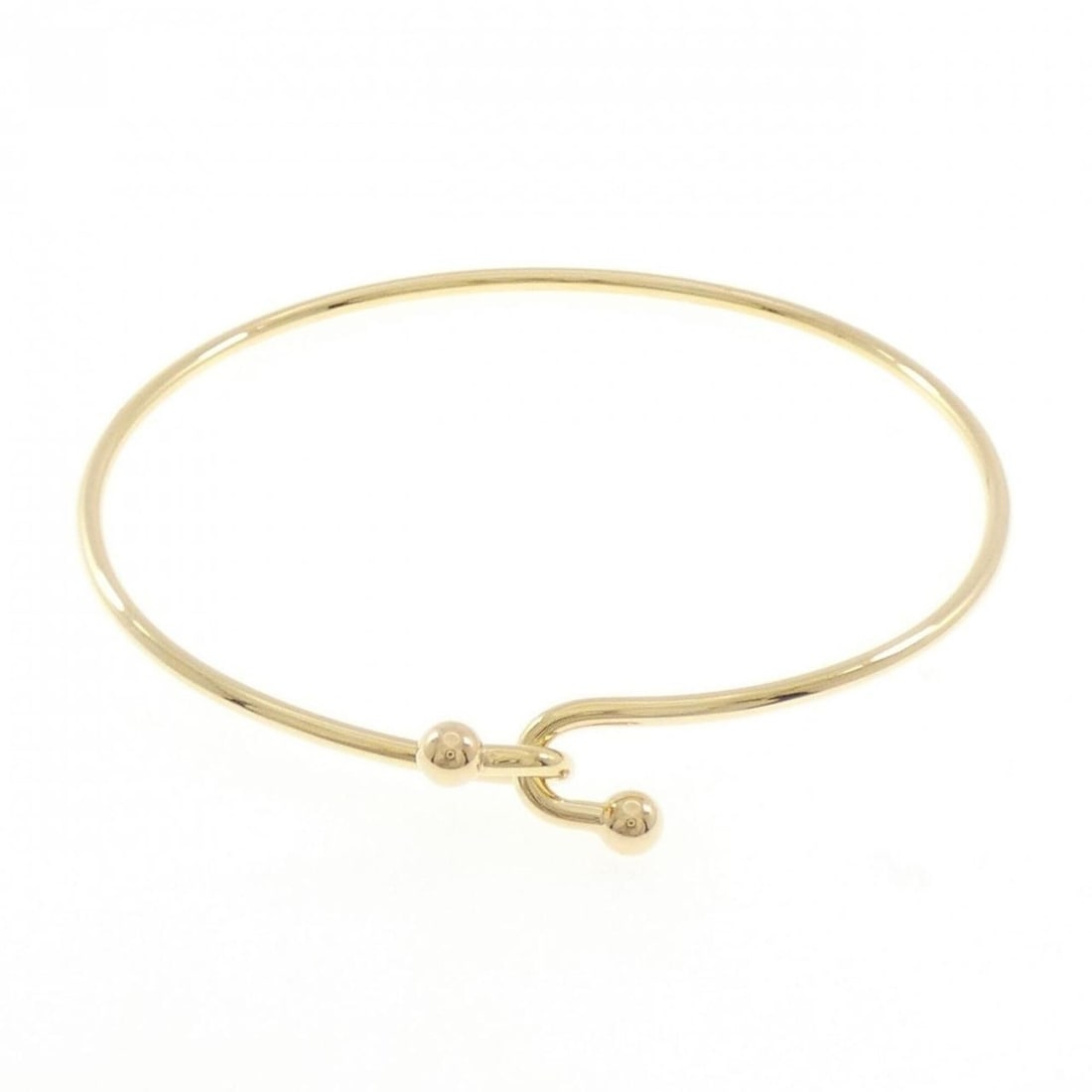 Tiffany & Co. 750YG Bangle: --- Catalog ---Category: SizeLength: 17cm / 6.69''Category: DesignType: BangleGender: WomenMaterial: Yellow gold (18K)Category: GeneralBrand: Tiffany--- Item List ---Section: ConditionRanking: Rank