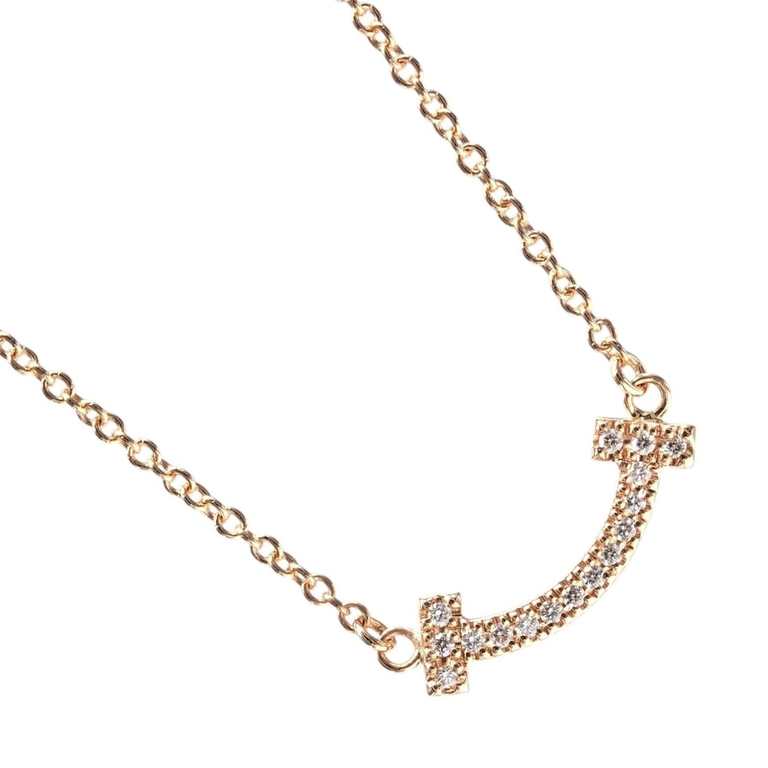Tiffany & Co. T Smile Mini Necklace, 18K Pink Gold with Diamonds, Approx. 2.34g.: --- Catalog ---Category: SizePendant Size: 4.8mm x 13.89mm / 0.18'' x 0.54''Neck Circumference: 44 cm / 17.32''Category: DesignColor: Pink goldGender: WomenMaterial: Pink gold (18K)Necklace Type: Neck