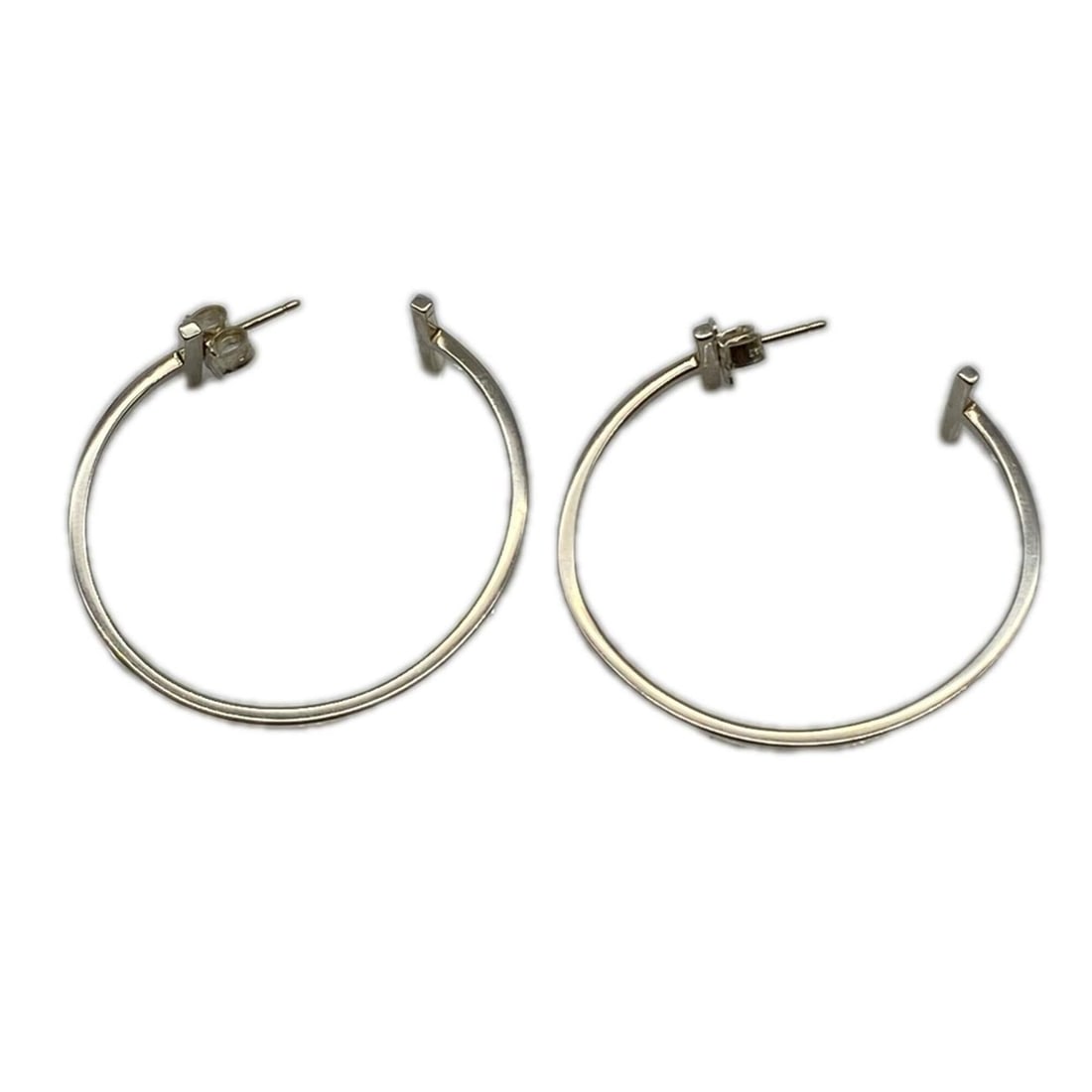 TIFFANY&Co. Tiffany T Wire Earrings, SV925, 35093699, Silver, Women's: --- Catalog ---Category: SizeWeight: 5.18g / 0.18oz.Size (HxWxD): 40.00mm x 35.00mm / 1.57'' x 1.38''Category: DesignType: Hoop earringsColor: SilverGender: WomenMaterial: SilverCategory: GeneralLine: