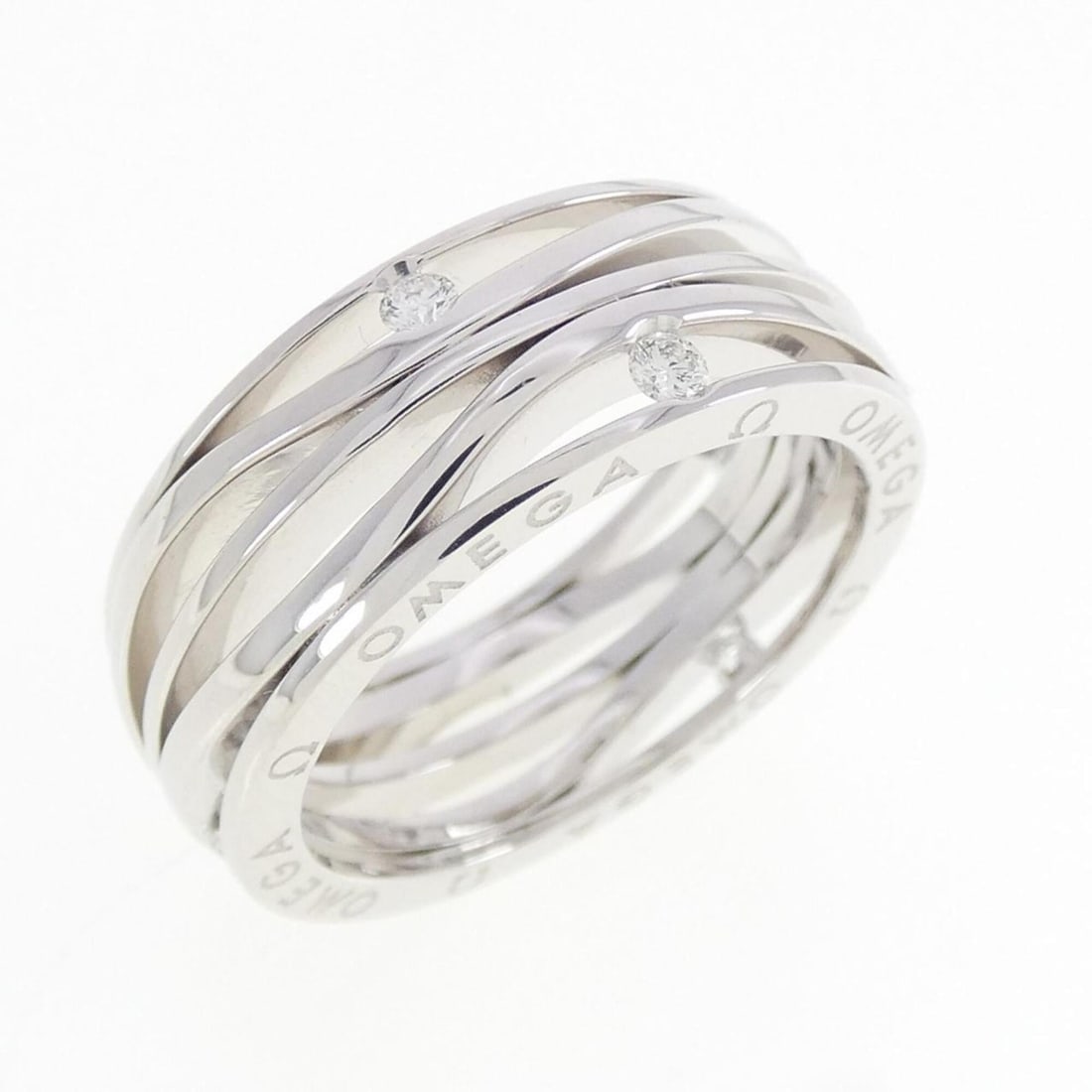 Omega Diamond Ring: --- Catalog ---Category: SizeUS Size: 6.5Brand Size: 52Category: DesignType: Band ringStone: DiamondGender: WomenMaterial: White gold (18K)Category: GeneralMPN: R17BCA0500152Brand: Omega--- Item List