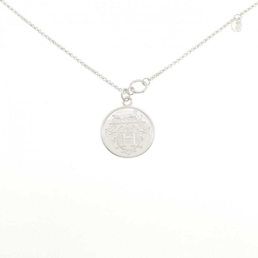 Hermes Hermès Ex-Libris MM Necklace: --- Catalog ---Category: SizePendant Size: 29.7mm x 24.9mm / 1.16'' x 0.98''Neck Circumference: 90 cm / 35.43''Category: DesignColor: Pink gold, SilverGender: Women,MenMaterial: Pink gold (18K),