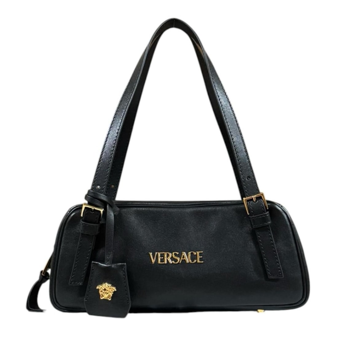 Versace Tag Nappa Bowling Bag Handbag Leather Black Women's VERSACE: --- Catalog ---Category: SizeSize (HxWxD): 11cm x 27cm / 4.33'' x 10.62''Category: DesignType: HandbagColor: BlackGender: WomenMaterial: Leather Category: GeneralBrand: VersaceCountry of Origin: Italy