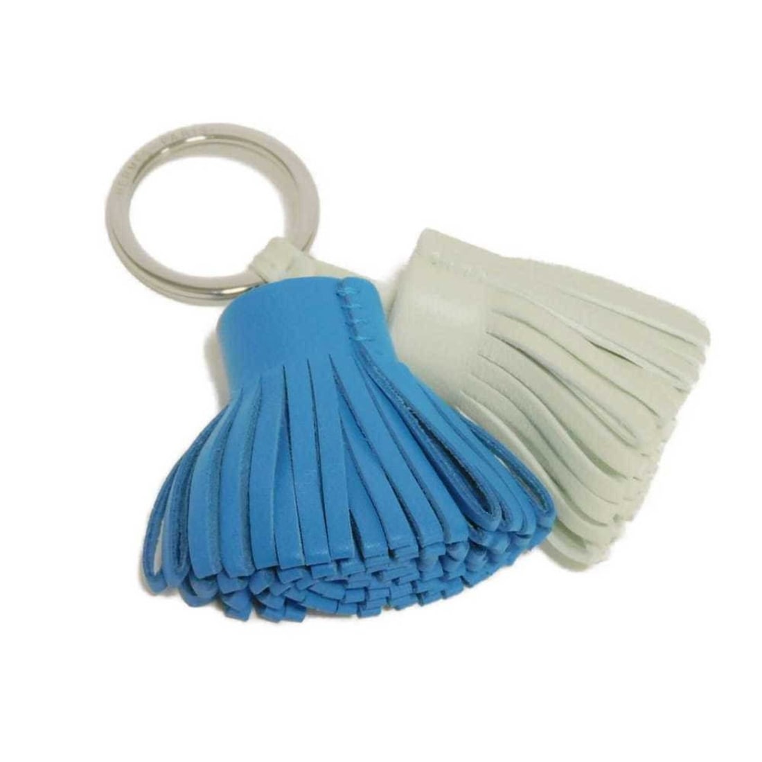 Hermes Carmen Unodos keychain in Blue Zanzibar, pastel light green, bicolor, and Agneau Milo Vert: --- Catalog ---Category: SizeSize (HxWxD): 9cm x 9cm x 3cm / 3.54'' x 3.54'' x 1.18''Category: DesignType: KeyringColor: Bicolor, Blue, Light greenGender: Men,WomenMaterial: Agneau Milo, PalladiumCate