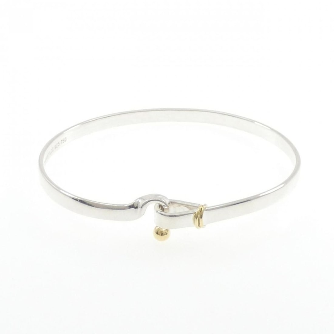 Tiffany Hook & Eye Bangle: --- Catalog ---Category: SizeLength: 18cm / 7.08''Category: DesignType: BangleColor: Gold, Yellow goldGender: WomenMaterial: Silver 925, Yellow gold (18K)Category: GeneralBrand: Tiffany--- Item List