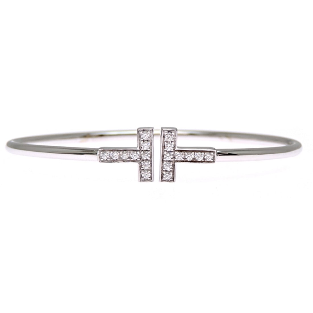 Tiffany & Co. 18KWG T Diamond Wire Bracelet for Women and Men, 18K White Gold: --- Catalog ---Category: SizeLength: 15.5cm / 6.1''Category: DesignType: Charm braceletStone: DiamondGender: Men,WomenMaterial: White gold (18K)Category: GeneralBrand: Tiffany--- Item List ---Section: