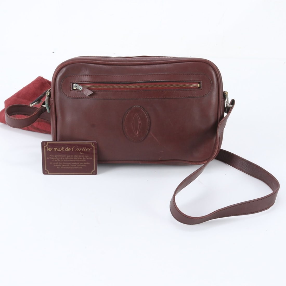 Cartier Must Line Bordeaux Leather Shoulder Bag Crossbody for Women: --- Catalog ---Category: SizeSize (HxWxD): 17cm x 27cm x 6cm / 6.69'' x 10.62'' x 2.36''Category: DesignType: Crossbody bag, Shoulder bagColor: BordeauxGender: WomenMaterial: Leather Category: General