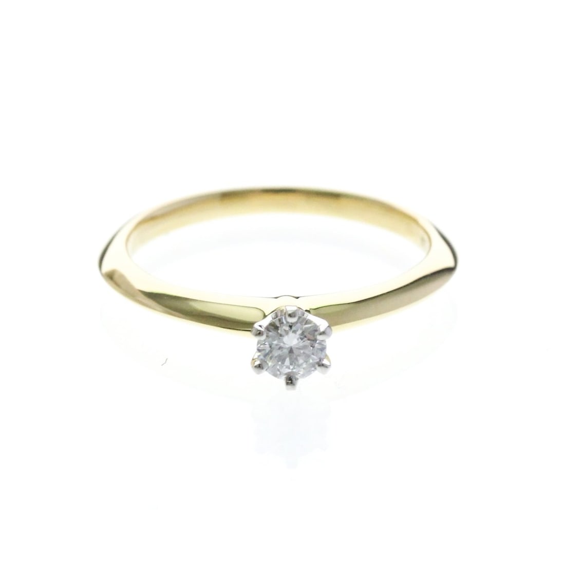 Tiffany Solitaire Diamond Ring Yellow Gold (18K) Fashion Diamond Band Ring Carat/0.19 Gold: --- Catalog ---Category: SizeWidth: 2.1mm / 0.08''Weight: 2.6g / 0.09oz.JP Size: 11US Size: 6Stone Size (HxW): 4.70mm x 4.30mm / 0.19'' x 0.17''Category: DesignType: Band ringColor: GoldMetal: GoldSto