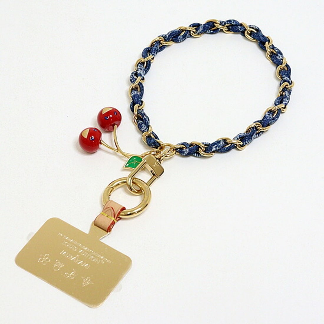 Louis Vuitton LV x TM Phone Charm M02623 Denim Cherry: --- Catalog ---Category: DesignType: Phone strapColor: Blue, Green, Red colorMaterial: MetalCategory: GeneralBrand: Louis VuittonCountry of Origin: Italy--- Item List ---Section: ConditionRanking: Ran
