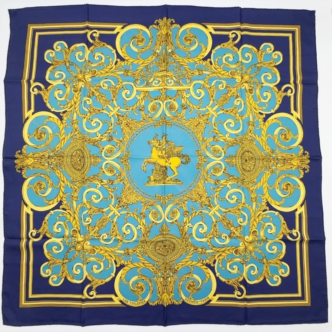 Hermes scarf/muffler, Carre 90, Tuileries Gardens, silk, blue, navy, gold, large size.: --- Catalog ---Category: SizeSize (LxW): 89.5cm x 88.5cm / 35.23'' x 34.84''Category: DesignType: ScarfColor: Blue, Gold, NavyGender: WomenMaterial: Silk Category: GeneralBrand: HermesCountry of