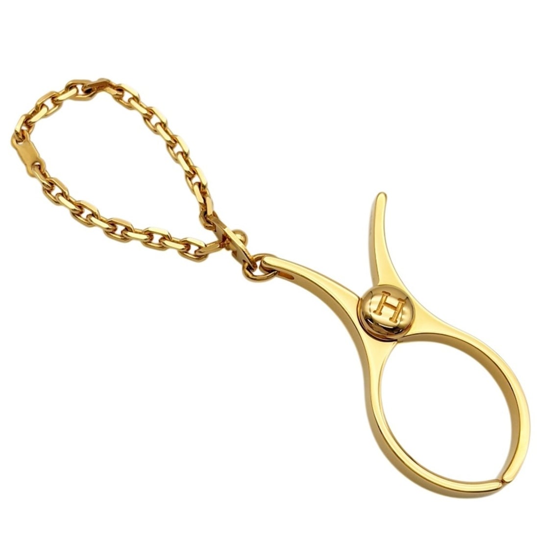 Hermes bag charm clip, Philou glove holder, gold metal.: --- Catalog ---Category: SizeSize (HxWxD): 5.7cm x 2.8cm x 5.00mm / 2.24'' x 1.1'' x 0.19''Category: DesignType: Glove holderColor: GoldGender: Women,MenMaterial: MetalCategory: GeneralBrand: