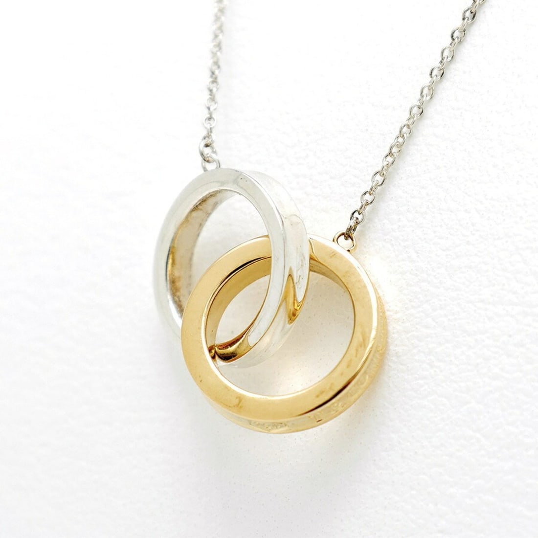 Tiffany & Co. 1837 Interlocking Circle Pendant Necklace, 60013936, 18K Yellow Gold/925, 40 cm,: --- Catalog ---Category: SizeWeight: 5.7g / 0.2oz.Diameter: 14mm / 0.55''Neck Circumference: 40 cm / 15.74''Category: DesignColor: Silver, Yellow goldGender: WomenMaterial: Silver 925, Yellow gold (18