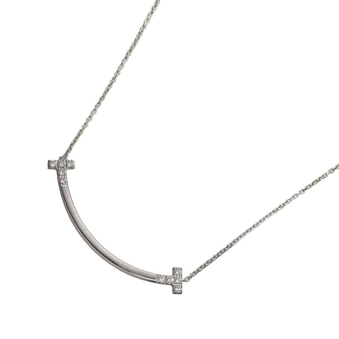 Tiffany & Co. T Smile Diamond 0.19ct Necklace, Medium (45cm), 18K WG White Gold 750.: --- Catalog ---Category: SizeNeck Circumference: 45 cm / 17.71''Category: DesignColor: White goldGender: WomenMaterial: White gold (18K)Necklace Type: NecklaceCategory: GeneralBrand: Tiffany--- Item L