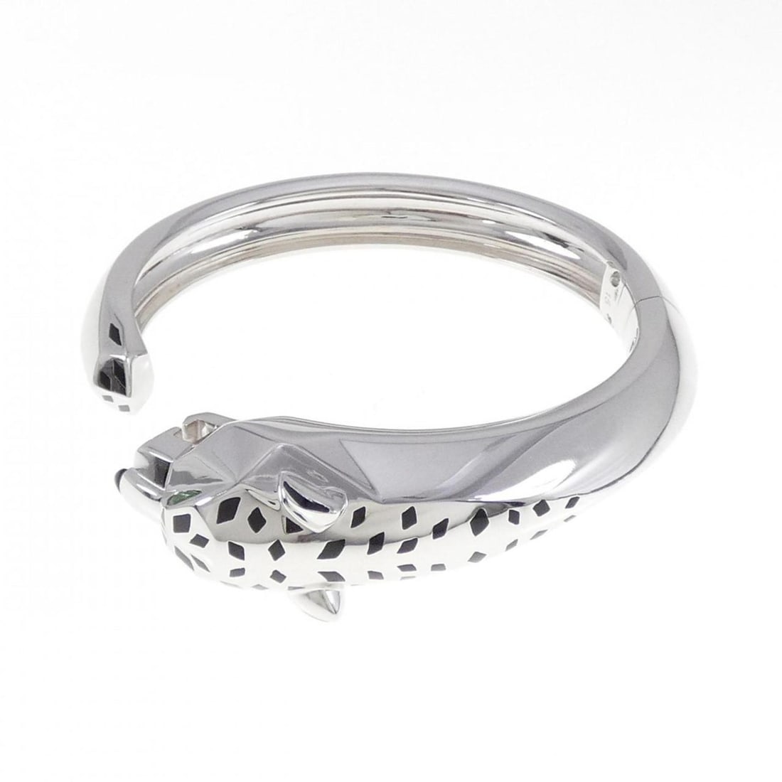 Cartier Panthere Bangle: --- Catalog ---Category: SizeWidth: 1.79cm / 0.7''Weight: 86.6g / 3.05oz.Total Length: 15.5cm / 6.1''Category: DesignType: BangleStone: Garnet, OnyxGender: WomenMaterial: Resin, White gold (18K)Catego