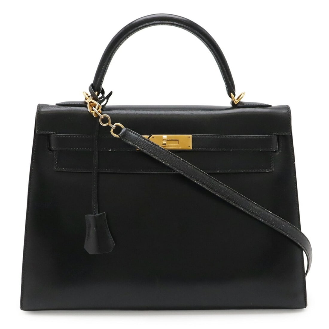 HERMES Kelly 32 handbag, external stitching, box calf leather, black, with "T" stamp.: --- Catalog ---Category: SizeSize (HxWxD): 23cm x 12cm / 9.05'' x 4.72''Category: DesignType: HandbagColor: BlackGender: WomenMaterial: Box calf leather Category: GeneralBrand: Hermes--- Item List ---