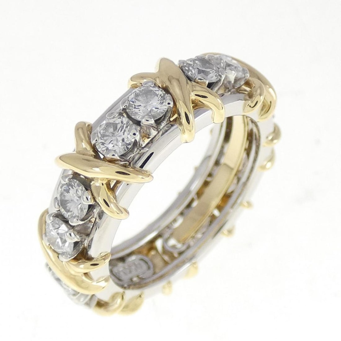 Tiffany 16 Stone Jean Schlumberger Ring: --- Catalog ---Category: SizeWidth: 6.5mm / 0.26''Weight: 8.4g / 0.29oz.JP Size: 8US Size: 4.5Category: DesignType: Band ringStone: DiamondGender: WomenMaterial: Platinum, Yellow gold (18K)Category: G