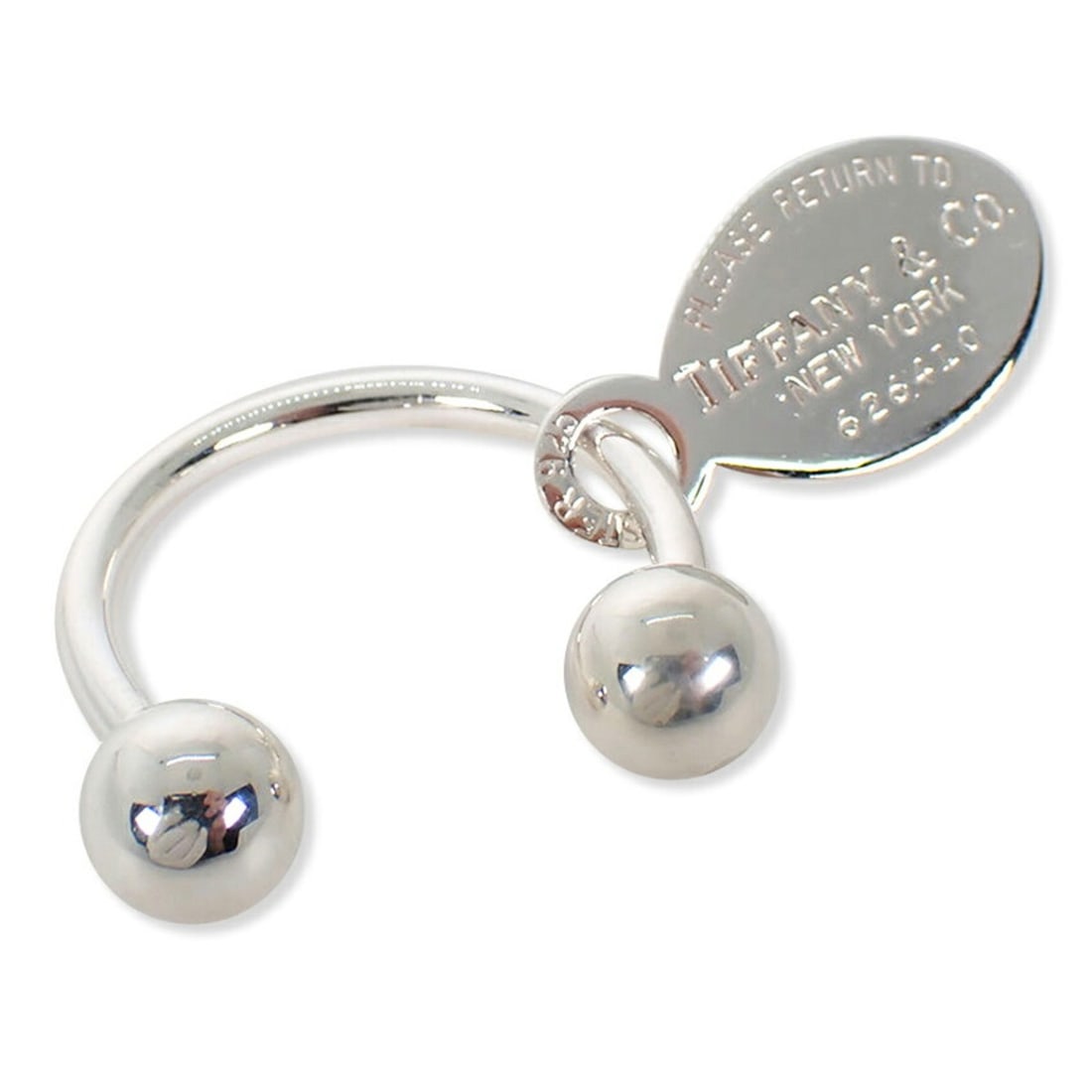 TIFFANY & Co. 925 Return to Tiffany Oval Tag Keyring: --- Catalog ---Category: SizeSize (HxWxD): 2.93cm x 2.88cm / 1.15'' x 1.13''Category: DesignType: KeyringGender: WomenMaterial: Sterling silver 925Category: GeneralBrand: Tiffany--- Item List ---Secti