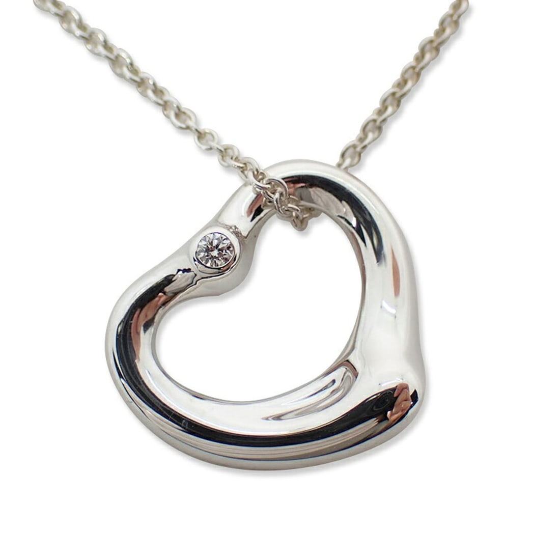 TIFFANY & Co. 925 Heart Diamond 2pc Pendant Necklace: --- Catalog ---Category: SizePendant Size: 14mm x 15mm / 0.55'' x 0.59''Neck Circumference: 41.5 cm / 16.33''Category: DesignStone: DiamondGender: WomenMaterial: Sterling silver 925Necklace Type: Neck