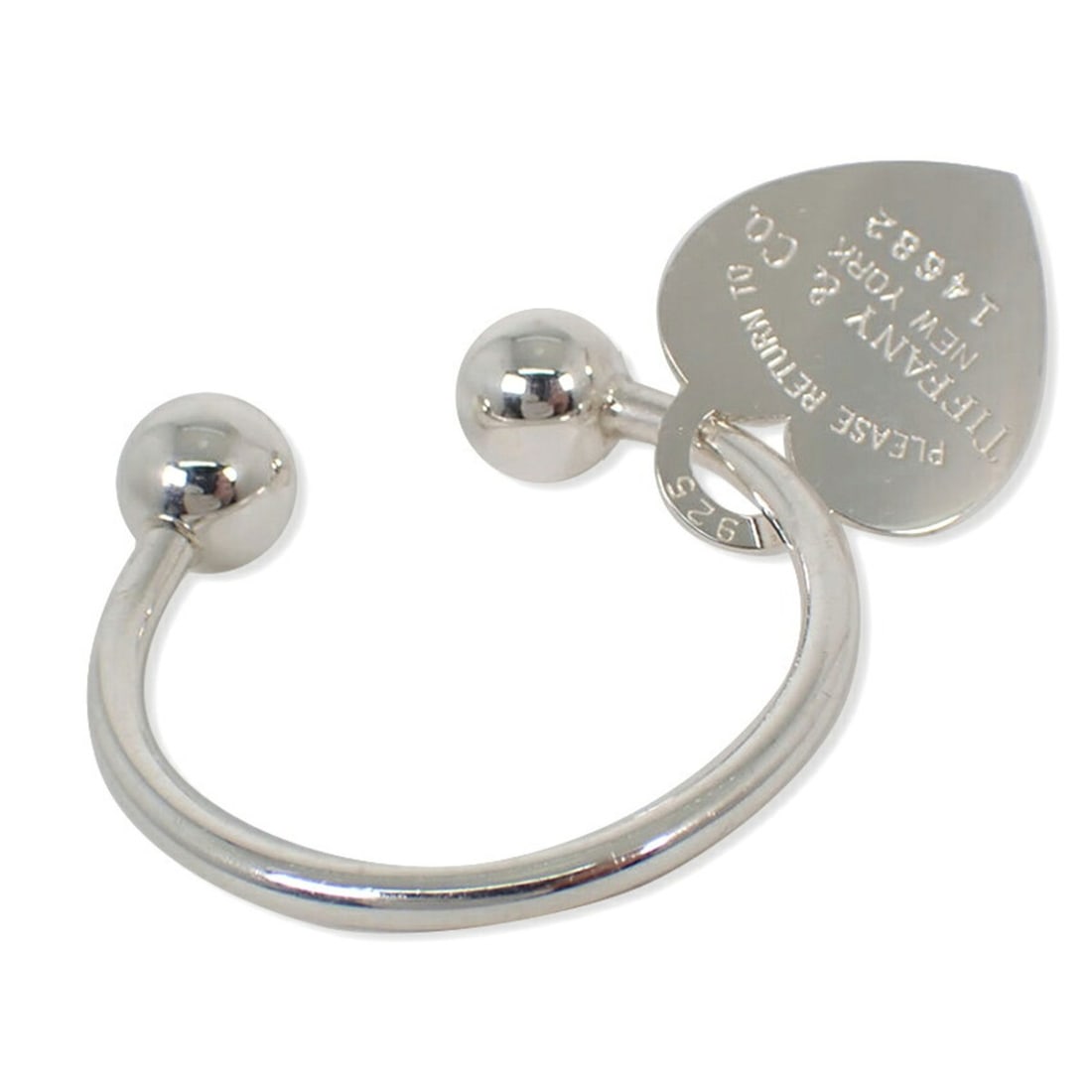 TIFFANY & Co. 925 Return to Tiffany Heart Tag Keyring: --- Catalog ---Category: DesignType: KeyringGender: WomenMaterial: Sterling silver 925Category: GeneralBrand: Tiffany--- Item List ---Section: ConditionRanking: Rank A Used - A few traces of usage,