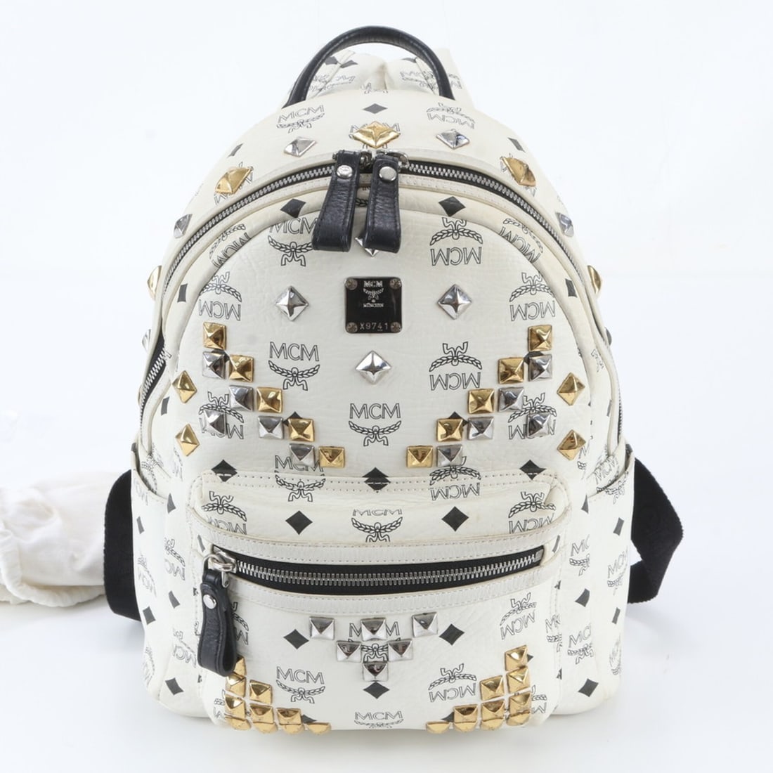 MCM Visetos Studded Leather Backpack Shoulder Bag for Women: --- Catalog ---Category: SizeSize (HxWxD): 31cm x 26cm x 13cm / 12.2'' x 10.23'' x 5.11''Category: DesignType: Backpack, Shoulder bagColor: WhiteGender: WomenMaterial: Leather , Coated canvas Category