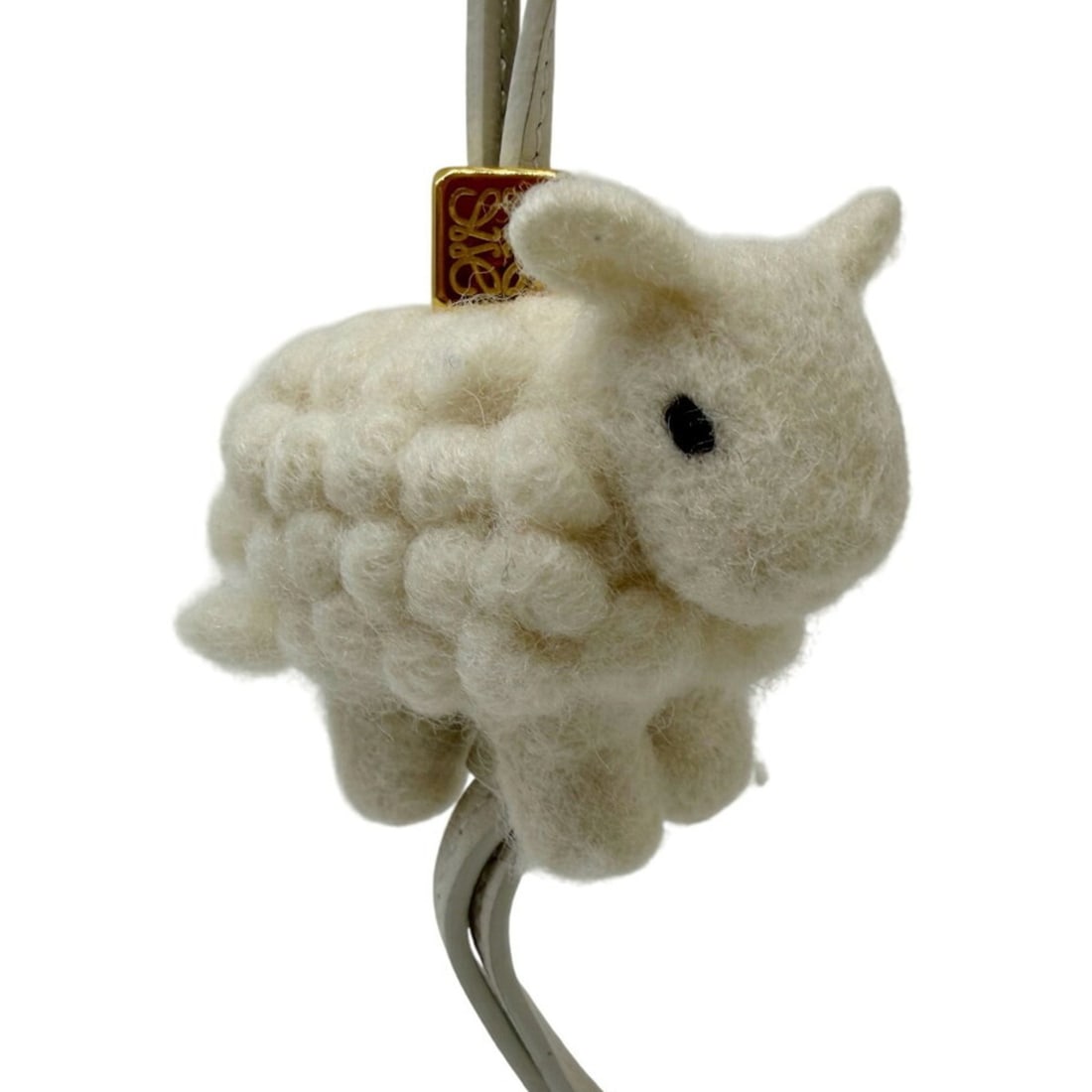 LOEWE Animal Bag Charm, Sheep Felt Leather, Ivory, for Women and Men (Bags): --- Catalog ---Category: DesignType: Handbag charmColor: IvoryGender: WomenMaterial: LeatherCategory: GeneralBrand: LoeweModel: animalProduct Description: Material: Felt--- Item List ---Section: Condi