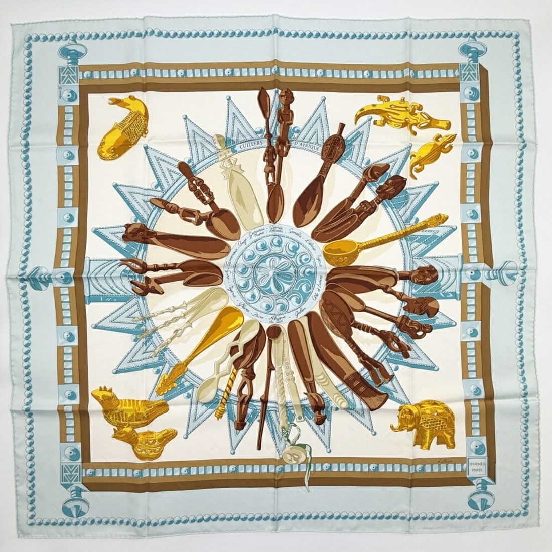Hermes scarf/muffler, size 90, silk, light blue and brown, "African Spoons" (CUILLERS D'AFRIQUE).: --- Catalog ---Category: SizeSize (LxW): 88cm x 88cm / 34.64'' x 34.64''Category: DesignType: ScarfColor: Brown, Gold, Light blue, WhiteGender: WomenMaterial: Silk Category: GeneralBrand: