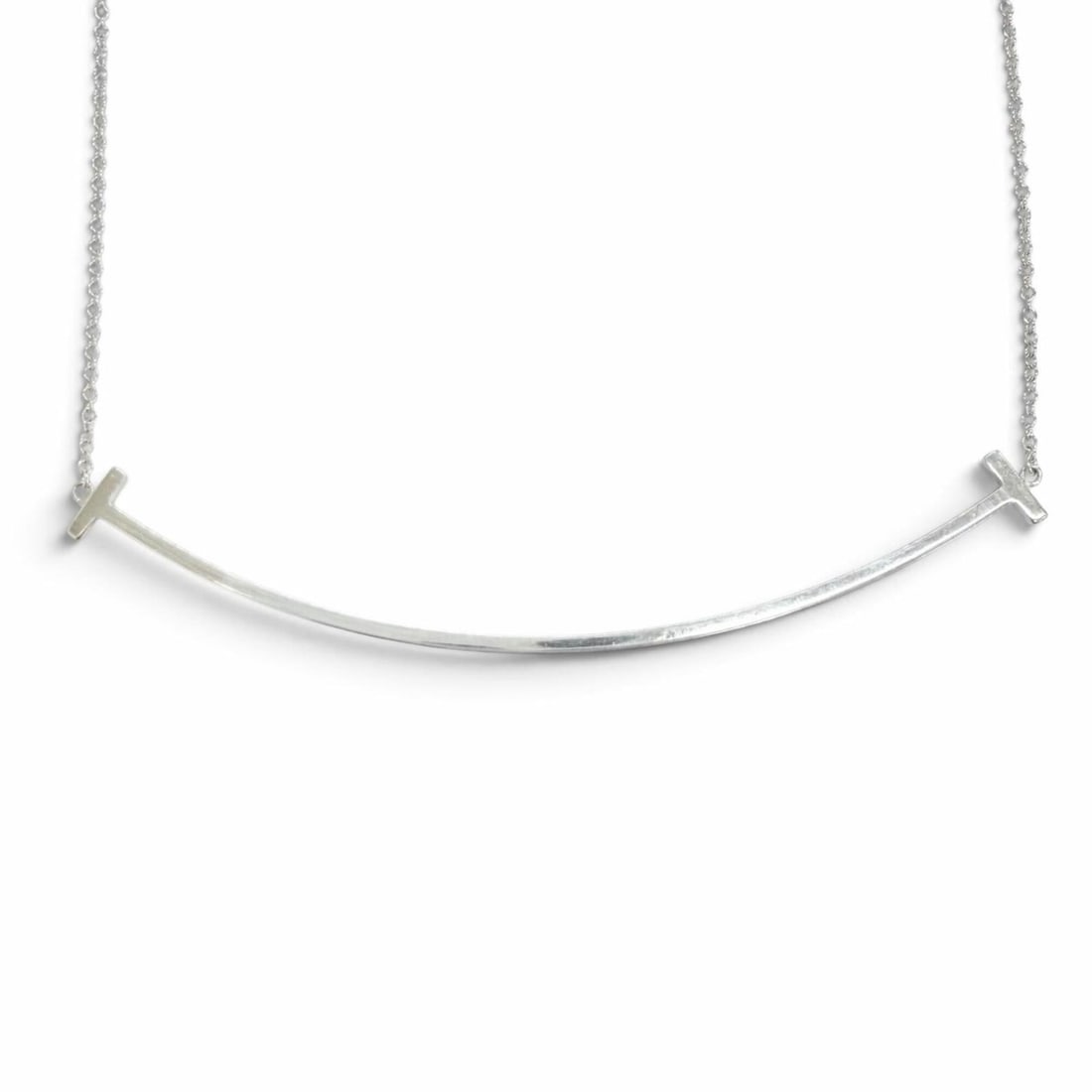 TIFFANY&Co. Tiffany T Smile Large Pendant Necklace, AG925 Sterling Silver, Made in Italy, Weight:: --- Catalog ---Category: SizePendant Size: 7mm x 70mm / 0.27'' x 2.75''Neck Circumference: 46 cm - 51 cm / 18.11'' - 20.07''Category: DesignColor: SilverGender: WomenMaterial: Silver 925Necklace Type: