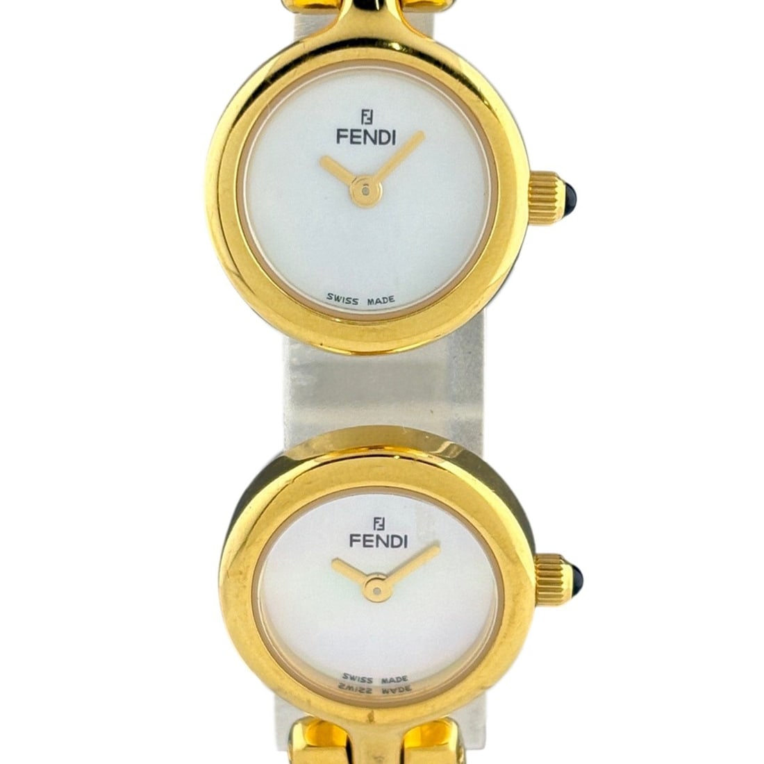 Fendi FENDI Double Face Dual Time Bangle Watch 620L Stainless Steel Gold Plated Quartz White Women's: --- Catalog ---Category: SizeWrist Size: 16cm / 6.29''Case Diameter: 18mm / 0.71''Category: DesignType: WristwatchGender: WomenColor (Dial): WhiteMaterial (Band): Gold plated, Stainless steelMaterial 
