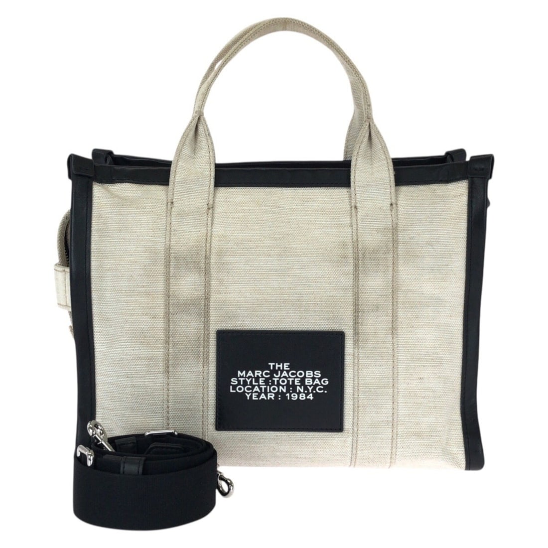 MARC JACOBS THE TOTE BAG 2-way bag in white and black with silver hardware. Canvas leather tote: --- Catalog ---Category: SizeSize (HxWxD): 24cm x 33cm x 15cm / 9.44'' x 12.99'' x 5.9''Category: DesignType: Shoulder bag, Tote bagColor: Black, WhiteGender: WomenMaterial: Canvas , Leather Hardware 