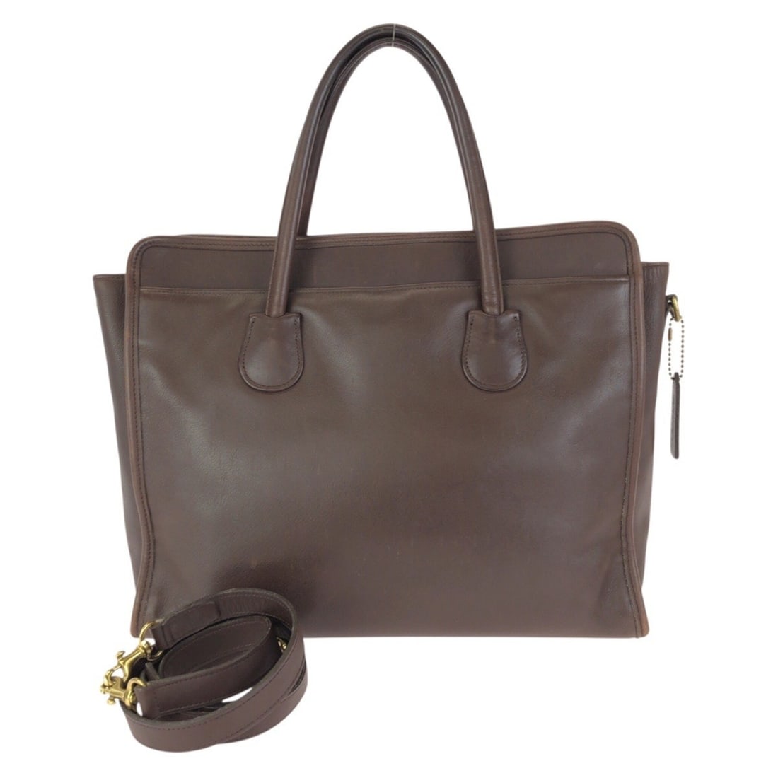 COACH Vintage Old Coach 2-way Brown Leather Bag with Gold Hardware (7302) Business Bag/Shoulder Bag,: --- Catalog ---Category: SizeSize (HxWxD): 26cm x 32cm x 11cm / 10.23'' x 12.59'' x 4.33''Category: DesignType: Shoulder bagColor: BrownGender: WomenMaterial: Leather Hardware Color: GoldCategory: Gen