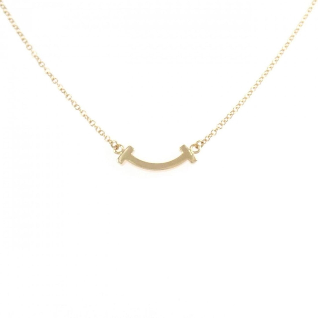 Tiffany T Smile Mini Necklace: --- Catalog ---Category: SizePendant Size: 3.6mm x 14.4mm / 0.14'' x 0.56''Neck Circumference: 41 cm - 46 cm / 16.14'' - 18.11''Category: DesignGender: WomenMaterial: Pink gold (18K)Pendant Type: Pend
