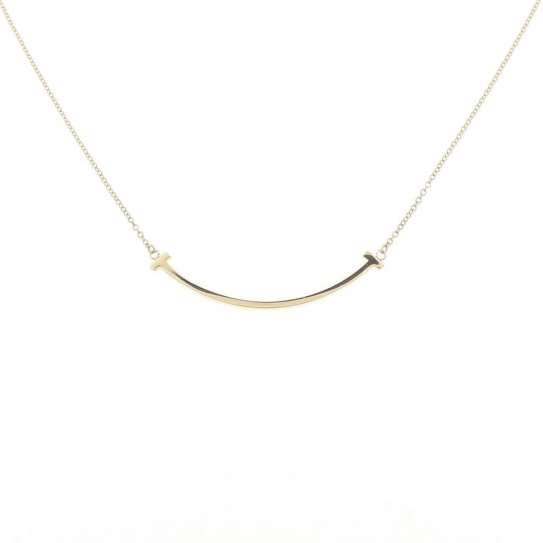 Tiffany T Smile Small Necklace: --- Catalog ---Category: SizePendant Size: 3.6mm x 36.9mm / 0.14'' x 1.45''Neck Circumference: 40 cm - 45 cm / 15.74'' - 17.71''Category: DesignGender: WomenMaterial: Yellow gold (18K)Pendant Type: Pe