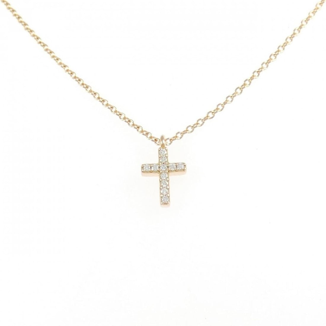 Tiffany Metro Cross Mini Necklace: --- Catalog ---Category: SizePendant Size: 9.7mm x 5.8mm / 0.38'' x 0.22''Neck Circumference: 41 cm / 16.14''Category: DesignStone: DiamondGender: WomenMaterial: Pink gold (18K)Pendant Type:
