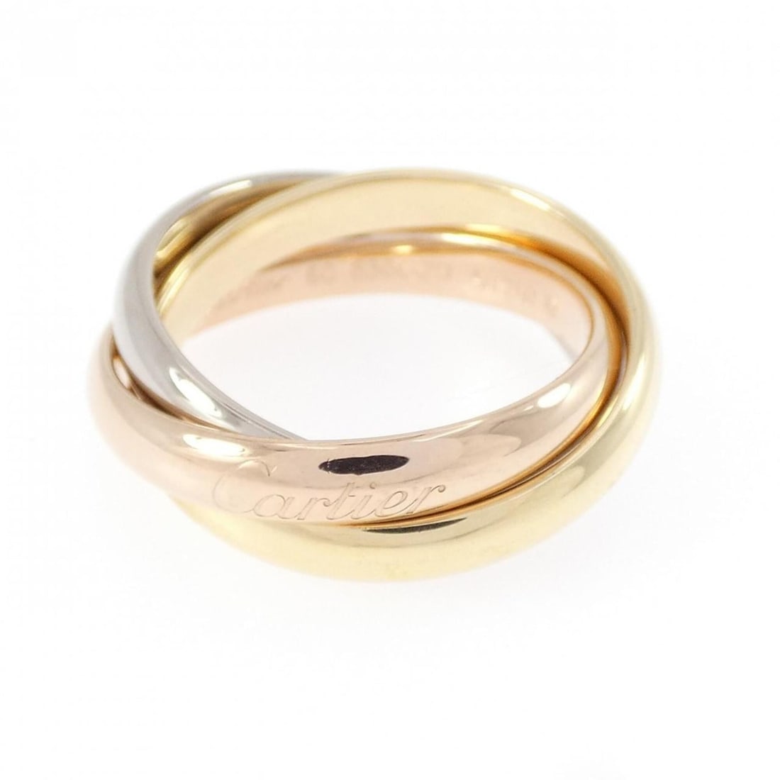 Cartier Trinity Ring: --- Catalog ---Category: SizeUS Size: 5.5Brand Size: 50Category: DesignType: Band ringColor: Pink gold, White gold, Yellow goldGender: WomenMaterial: Pink gold (18K), White gold (18K), Yellow gold