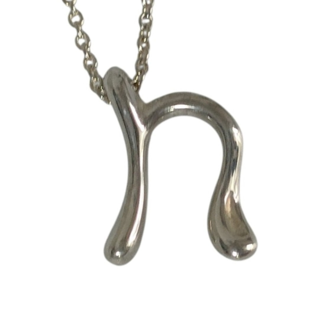TIFFANY&Co. Tiffany Letter Initial "n" Chain Pendant Necklace, 925 Silver, Women's: --- Catalog ---Category: SizePendant Size: 1.2mm x 1.3mm / 0.04'' x 0.05''Neck Circumference: 39 cm / 15.35''Category: DesignColor: SilverGender: WomenMaterial: Silver 925Necklace Type: Pendant neckla
