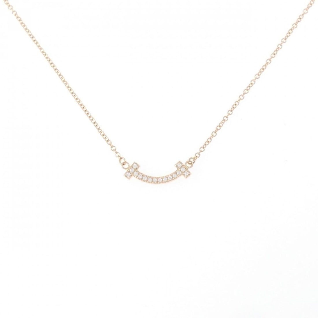Tiffany T Smile Mini Necklace: --- Catalog ---Category: SizePendant Size: 4.7mm x 13.7mm / 0.18'' x 0.53''Neck Circumference: 41 cm - 46 cm / 16.14'' - 18.11''Category: DesignColor: Pink goldGender: WomenMaterial: Pink gold