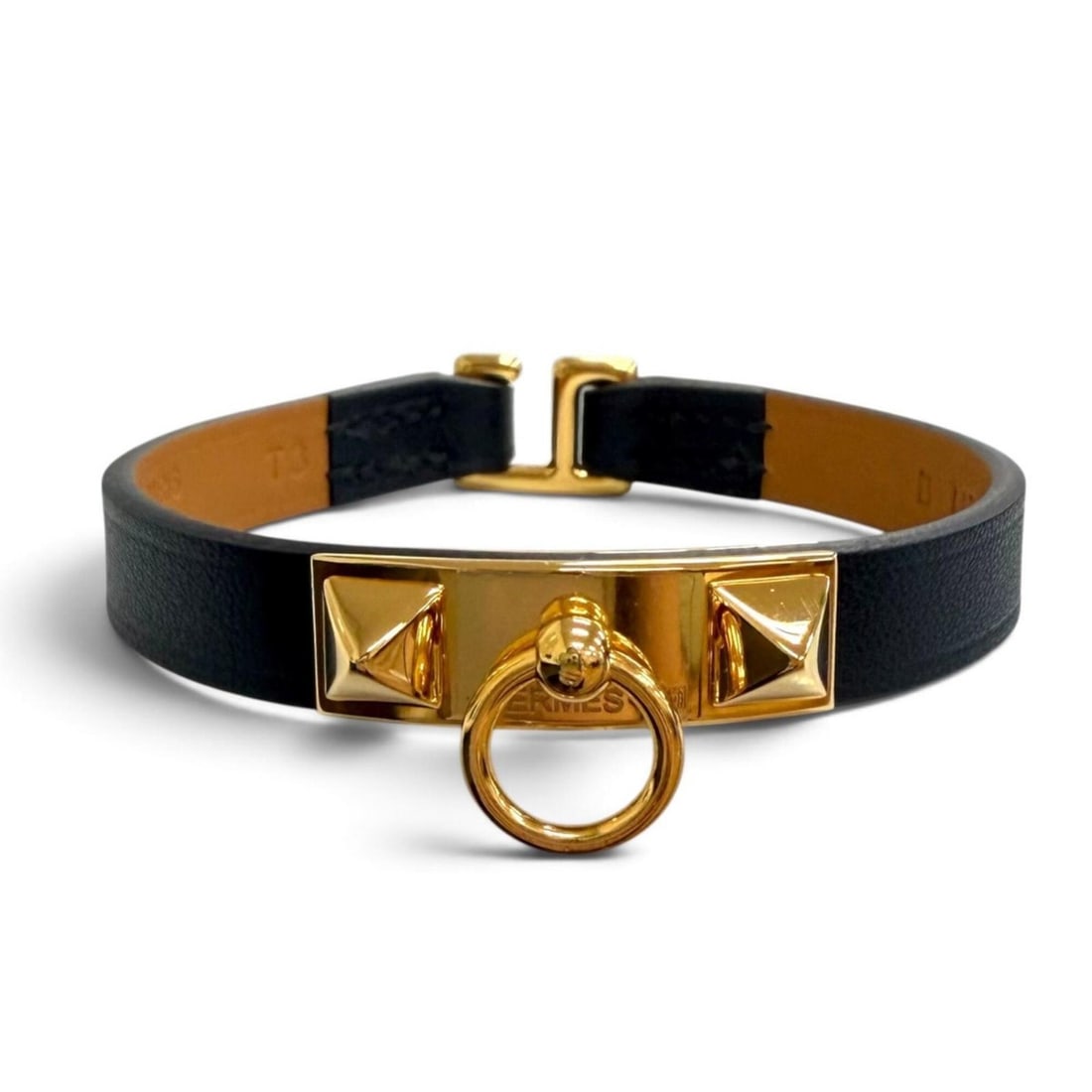 HERMES Micro Rival Swift Leather Bracelet with Gold Hardware, Black, T3 B Stamp, Made in France,: --- Catalog ---Category: SizeLength: 16cm / 6.29''Category: DesignType: Charm braceletColor: BlackGender: WomenMaterial: Swift leatherCategory: GeneralBrand: HermesCountry of Origin: France--- Item Li
