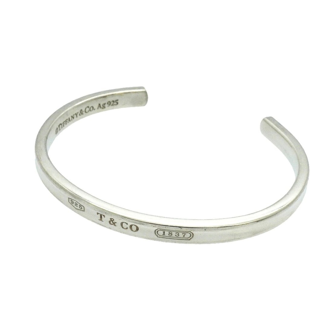 Tiffany & Co. Bangle 1837 Narrow Cuff Sterling Silver 925 Women's: --- Catalog ---Category: SizeLength: 16cm / 6.29''Category: DesignType: BangleGender: WomenMaterial: Silver 925Category: GeneralBrand: Tiffany--- Item List ---Section: ConditionRanking: Rank AB Used -