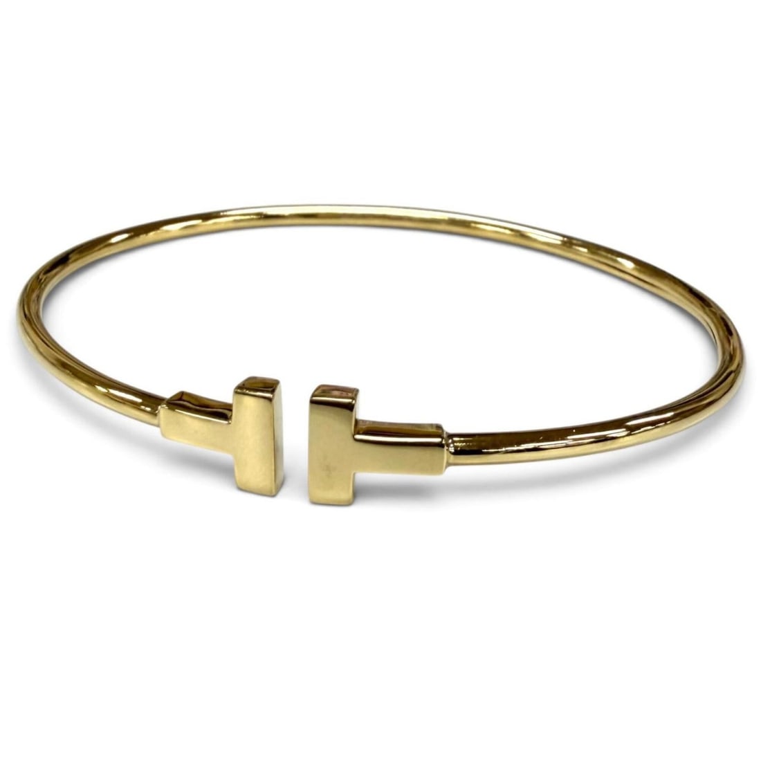 TIFFANY&Co. Tiffany T Narrow Wire Bracelet AU750 (YG) Yellow Gold Bracelet, Weight 5.92g, Women's: --- Catalog ---Category: SizeLength: 15cm / 5.9''Category: DesignType: Charm braceletColor: Yellow goldGender: WomenMaterial: Yellow gold (18K)Category: GeneralBrand: Tiffany--- Item List ---Section: 