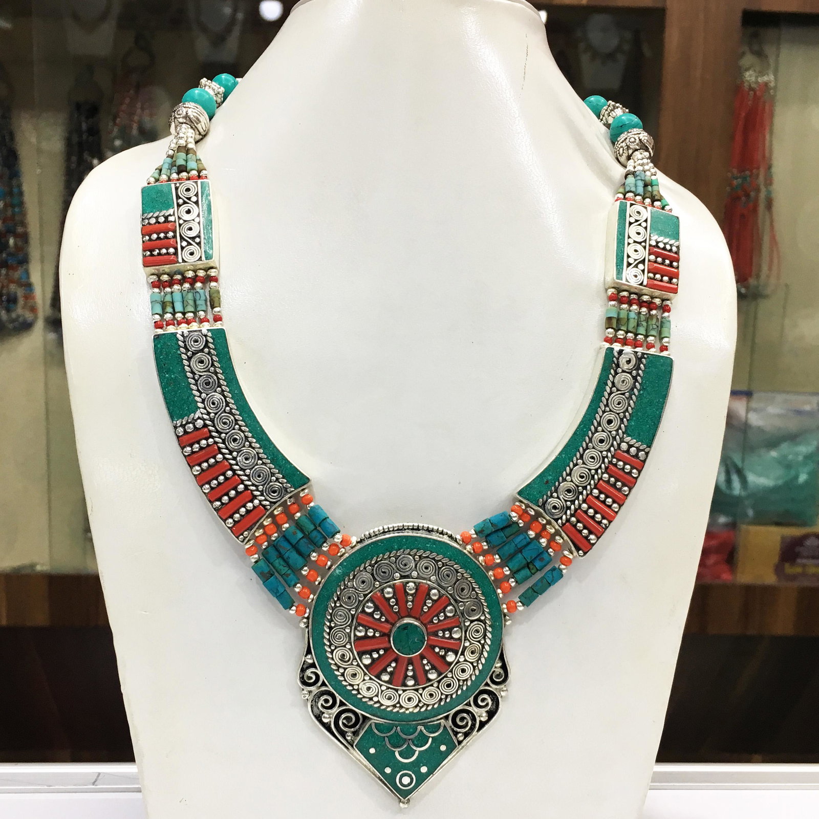 Nepalese Tibetan Silver Tibetan Turquoise Necklace: Tibet Natural Stone Hand Made Coral Necklace......This elegant Necklace was handcrafted in Tibet, the home of exquisite jewelry craftsmanship. It was skillfully made with large natural Turquoise, each