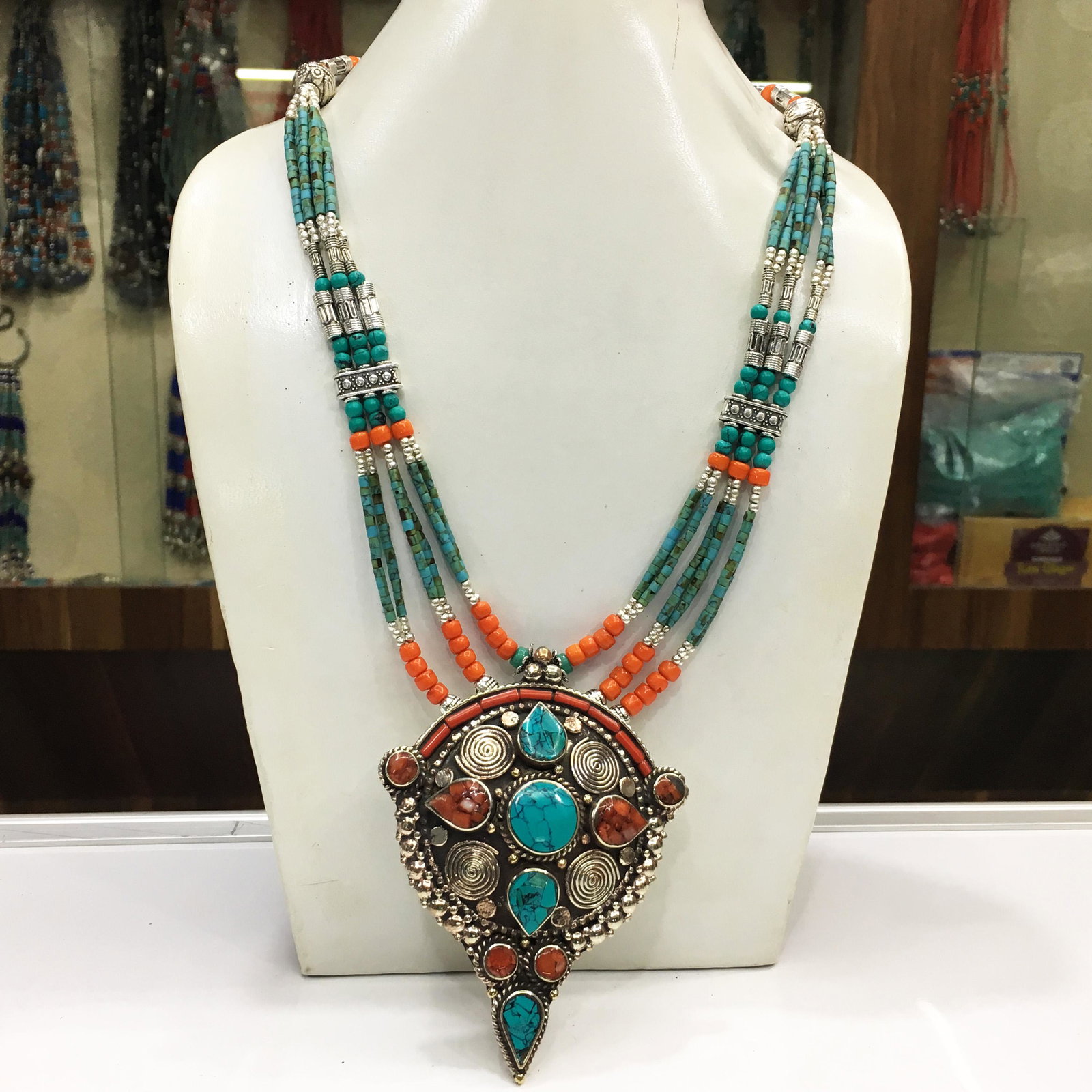 Buddhist Turquoise Vintage Tibetan Pendant Necklace: Tibet Natural Stone Hand Made Coral Necklace......This elegant Necklace was handcrafted in Tibet, the home of exquisite jewelry craftsmanship. It was skillfully made with large natural Turquoise, each