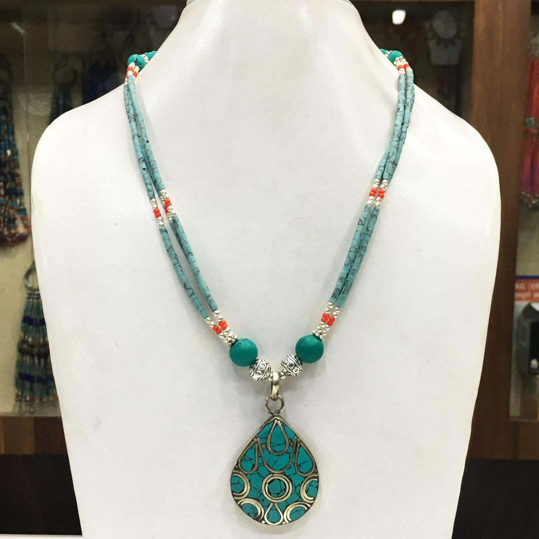 Tibetan Buddhist Turquoise Ethnic Pendant Necklace: Tibet Natural Stone Handmade Necklace......This elegant Necklace was handcrafted in Tibet, the home of exquisite jewelry craftsmanship. It was skillfully made with large natural Turquoise, each in a d